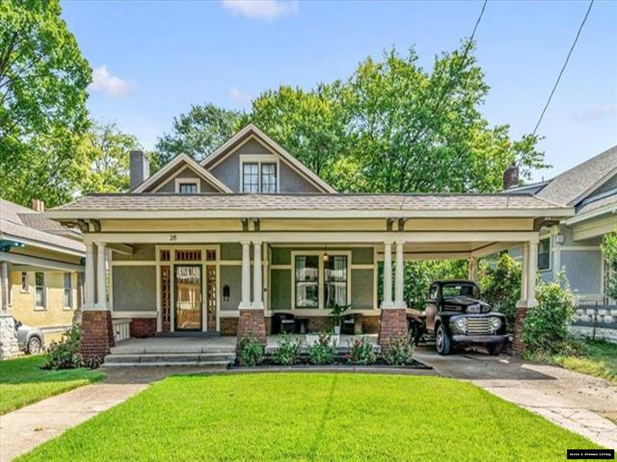 “Front exterior of 28 S Barksdale in Midtown Memphis with vintage truck in driveway — Acres & Avenues Living.”